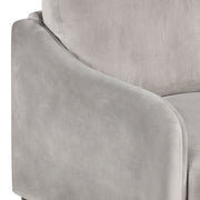 Right facing close up of the leg on a modern grey velvet loveseat with sloping arms on a white background