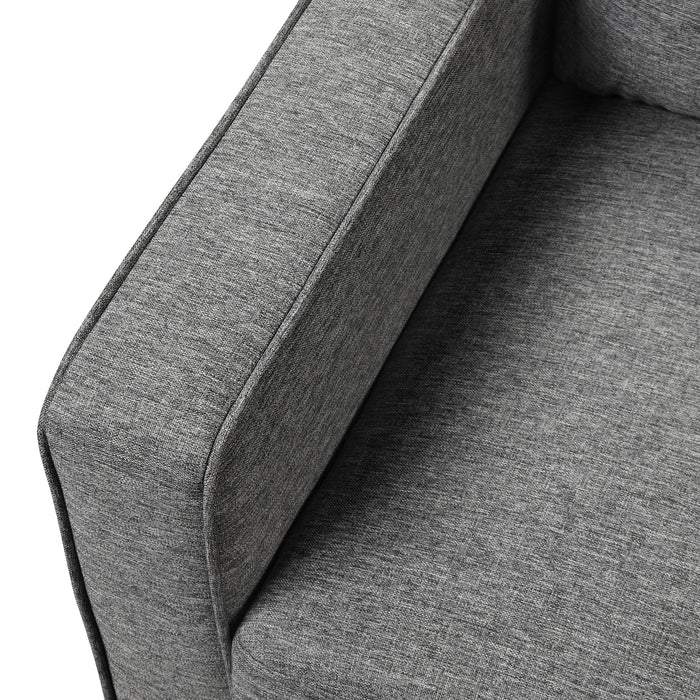 Right facing close up of the armrest of a transitional grey linen-look accent armchair on a white background