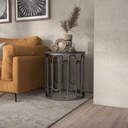 Front facing contemporary black natural stone and metal round end table in a room with accessories