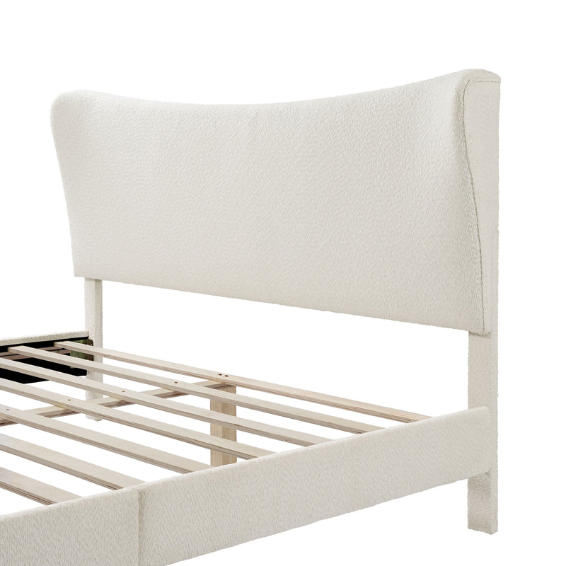 Left facing close up of the headboard on a modern white boucle upholstered queen bed on a white background