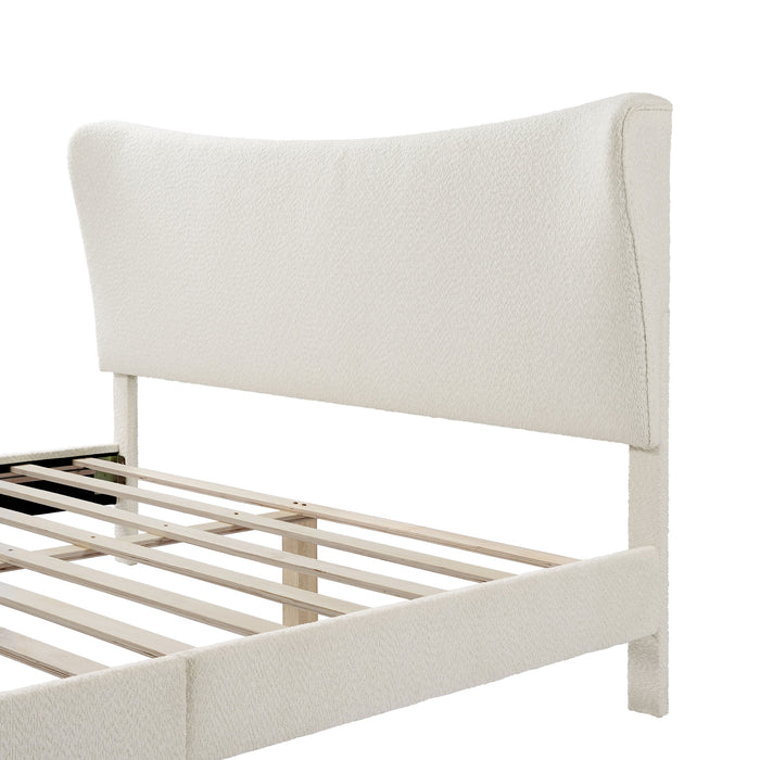 Left facing close up of the headboard on a modern white boucle upholstered queen bed on a white background