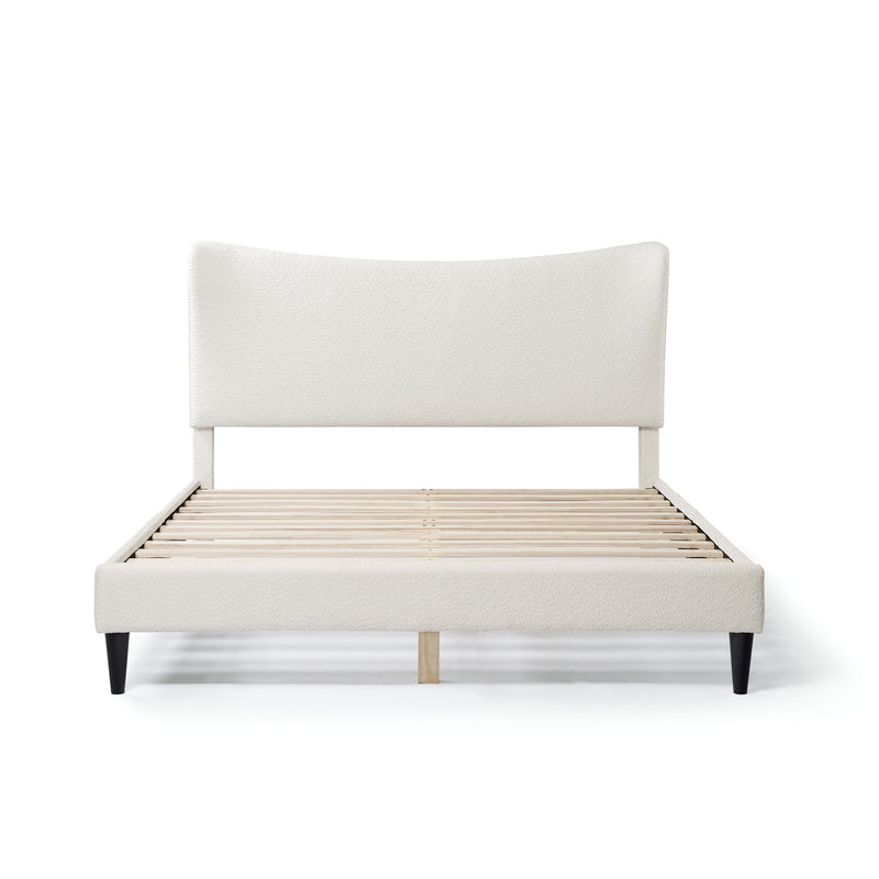 Front facing modern white boucle upholstered queen bed on a white background