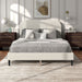 Front facing modern white boucle upholstered queen bed in a room with linens and accessories