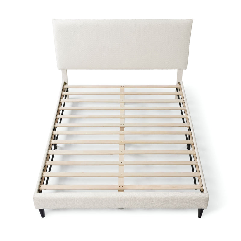 Front facing high-camera view of a modern white boucle upholstered queen bed on a white background