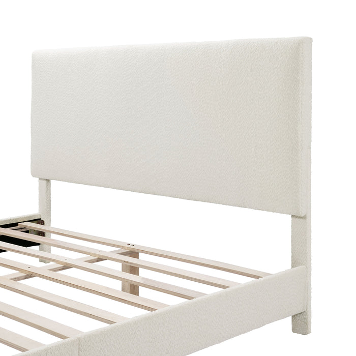 Left facing close up of the headboard of a modern white boucle upholstered queen bed on a white background