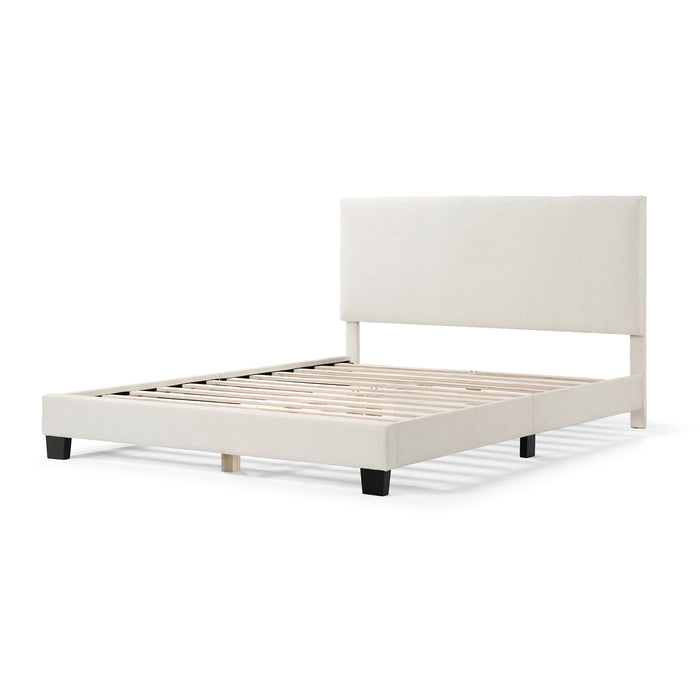 Left facing modern white boucle upholstered queen bed on a white background