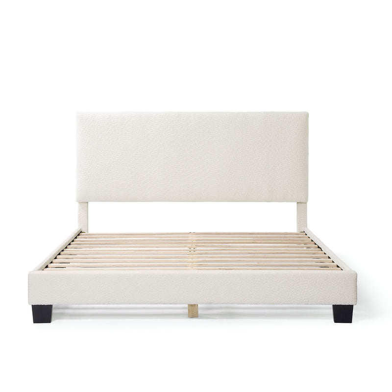 Front facing modern white boucle upholstered queen bed on a white background