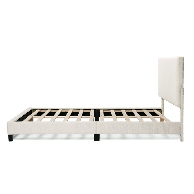 Front facing side view of a modern white boucle upholstered queen bed on a white background