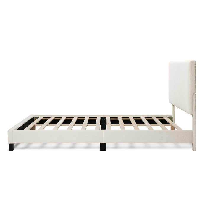Front facing side view of a modern white boucle upholstered queen bed on a white background