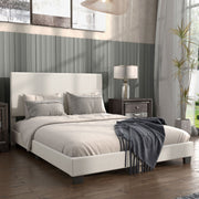 Right facing modern white boucle upholstered queen bed in a room with linens and accessories