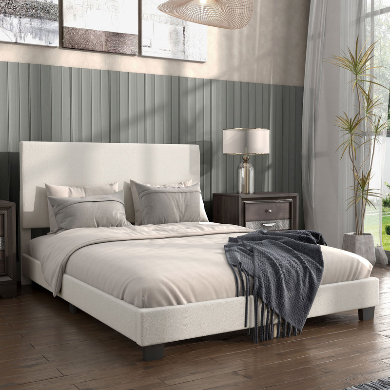 Right facing modern white boucle upholstered queen bed in a room with linens and accessories