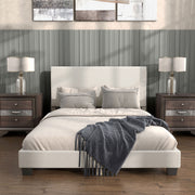 Front facing modern white boucle upholstered queen bed in a room with linens and accessories