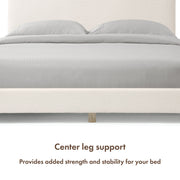 Front facing close up of a modern white boucle upholstered queen bed that highlights its center leg support