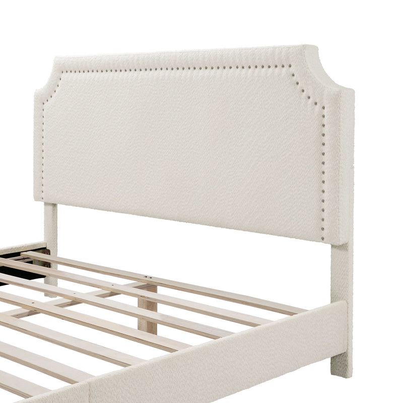 Left facing close up of the headboard of a modern white boucle upholstered queen bed on a white background