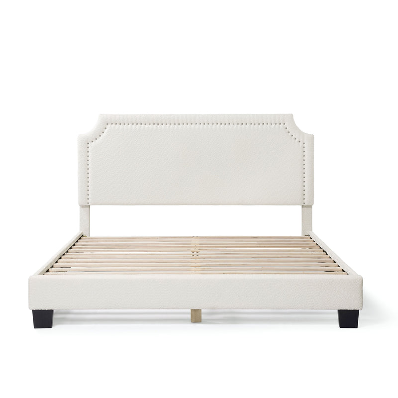 Front facing modern white boucle upholstered queen bed on a white background