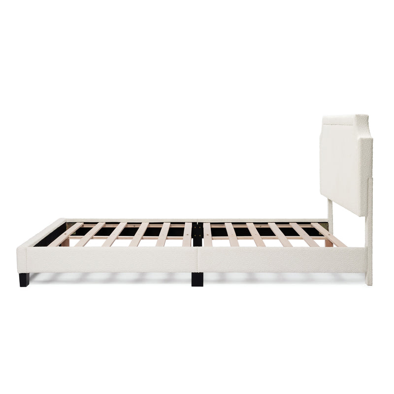 Front facing side view of a modern white boucle upholstered queen bed on a white background