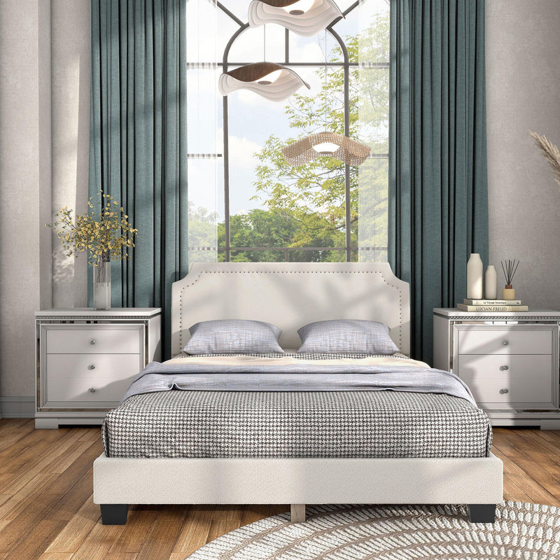 Front facing modern white boucle upholstered queen bed in a room with linens and accessories