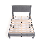 Front facing high-camera view of a modern gray velvet textured headboard full platform bed on a white background