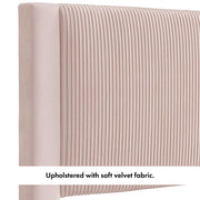 Right facing close up of the upholstered headboard of a modern gray velvet textured headboard full platform bed on a white background