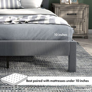 Right facing close up showing the mattress thickness of this modern gray velvet textured headboard full platform bed in a room with linens and accessories