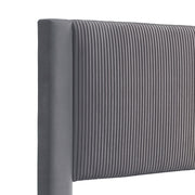 Right facing close up view of the headboard on a modern gray velvet textured headboard queen platform bed on a white background