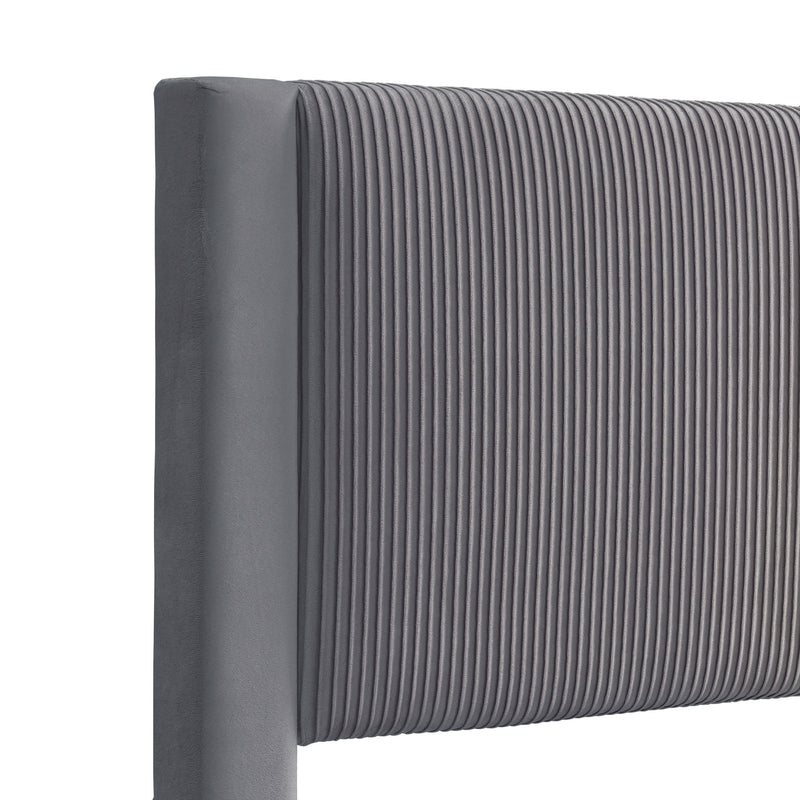 Right facing close up view of the headboard on a modern gray velvet textured headboard queen platform bed on a white background