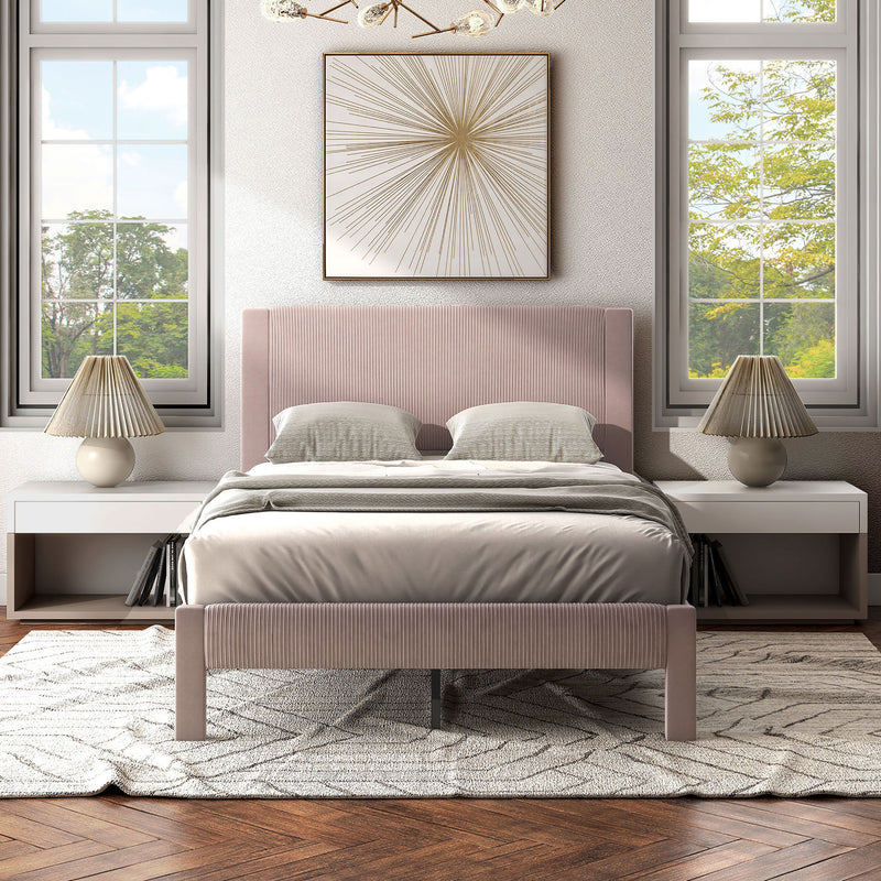 Front facing modern pink velvet textured headboard full platform bed in a room with linens and accessories