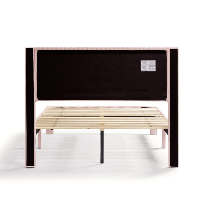 Front facing back view of a modern pink velvet textured headboard full platform bed on a white background