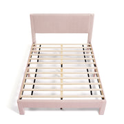 Front facing high-camera view of a modern pink velvet textured headboard queen platform bed on a white background
