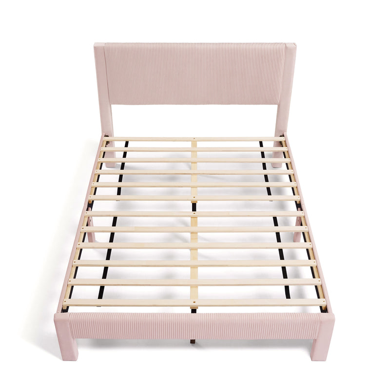 Front facing high-camera view of a modern pink velvet textured headboard queen platform bed on a white background
