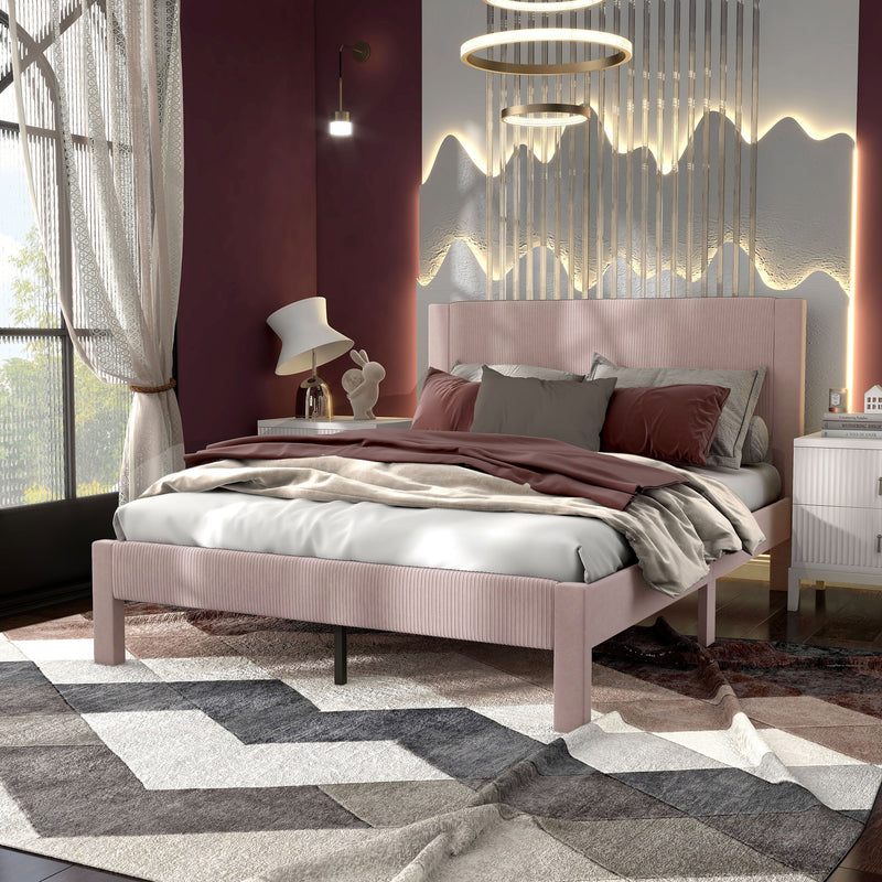 Left facing modern pink velvet textured headboard queen platform bed in a room with linens and accessories