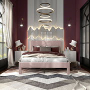 Front facing modern pink velvet textured headboard queen platform bed in a room with linens and accessories