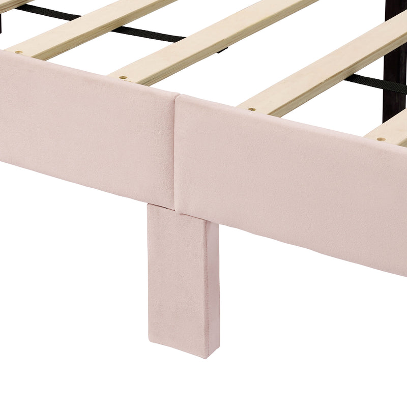 Left facing close up view of the support leg and slats on a modern pink velvet textured headboard queen platform bed on a white background
