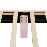 Front facing close up view of the interior support leg and slats on a modern pink velvet textured headboard queen platform bed on a white background