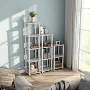 Right facing high-camera view of three shelf modular shelving units in a room with accessories