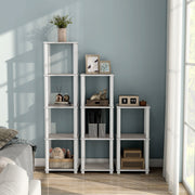 Front facing of three shelf modular shelving units in a room with accessories