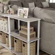 Left facing of the corner of a four-shelf modular shelving unit with support rods in a room with accessories