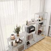 Right facing high-camera view of three various wide-shelf modular shelving unit with support rods in a room with accessories
