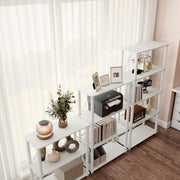 Right facing high-camera view of three various wide-shelf modular shelving unit with support rods in a room with accessories