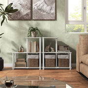 Front facing of two three-shelf modular shelving units with support rods in a room with accessories