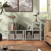 Front facing of two three-shelf modular shelving units with support rods in a room with accessories