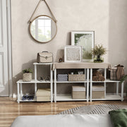 Front facing of three various shelf modular shelving unit with support rods in a room with accessories