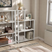 Right facing high-camera view of a five-shelf modular shelving unit with support rods in a room with accessories