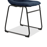 Right facing close up single view of the base on a set of two contemporary blue chenille dining side chairs with black bases on a white background