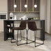Angled set of two contemporary brown chenille counter height stools with black bases in a room with accessories