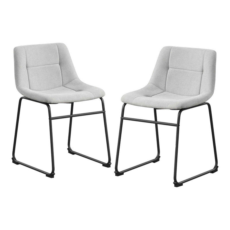 Angled set of two contemporary light grey chenille dining side chairs with black bases on a white background