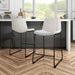 Angled set of two contemporary white chenille counter height stools with black bases in a room with accessories
