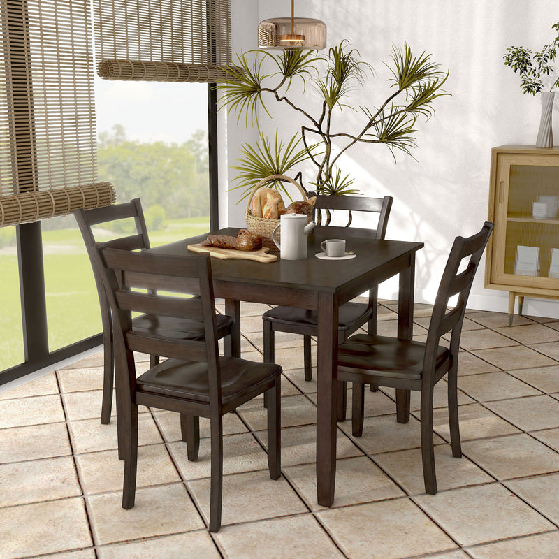 Side facing five-piece traditional espresso wooden dining set with a table and four chairs in a room with accessories