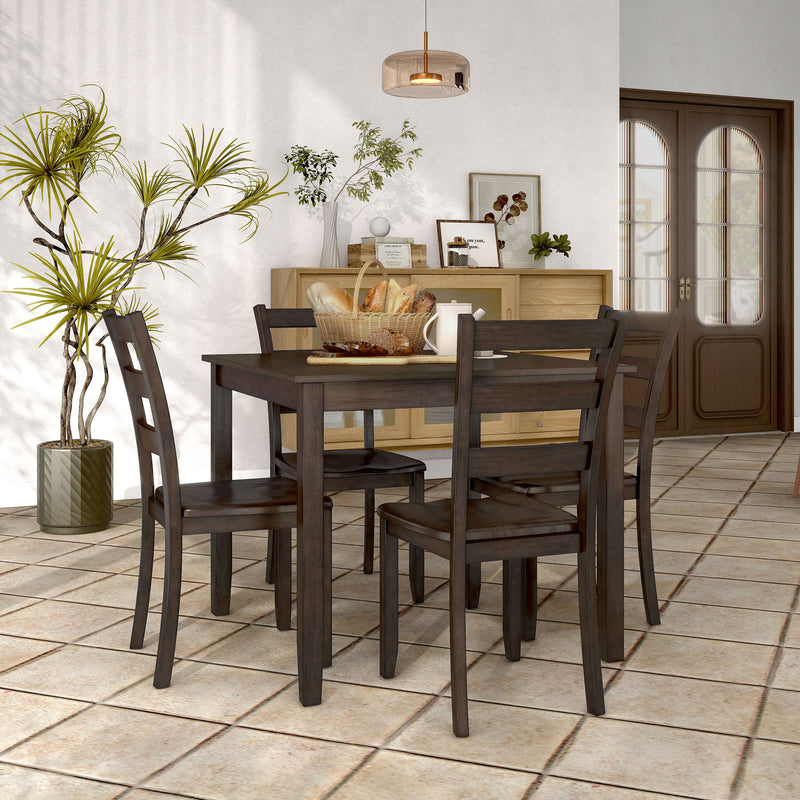 Side facing five-piece traditional espresso wooden dining set with a table and four chairs in a room with accessories