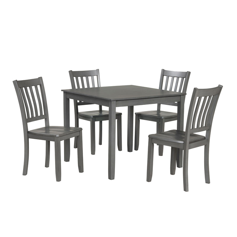 Side facing five-piece traditional grey wooden dining set with a table and four chairs on a white background